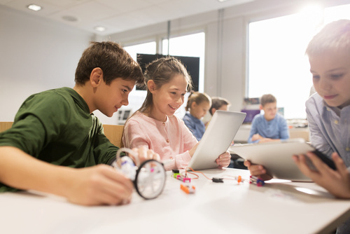 Children studying on laptop